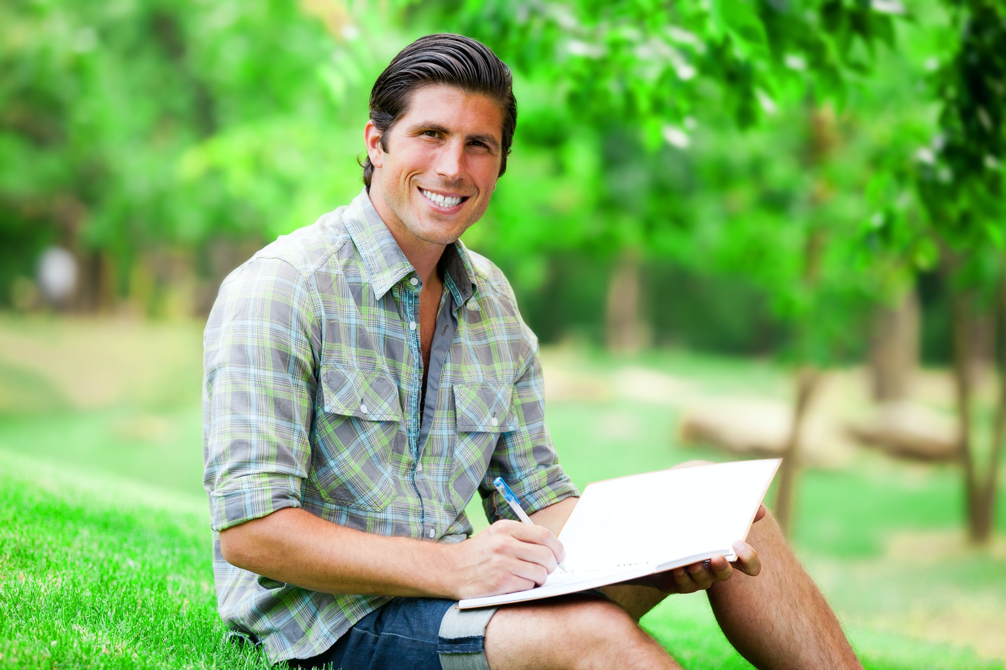 Young student with note at outdoor